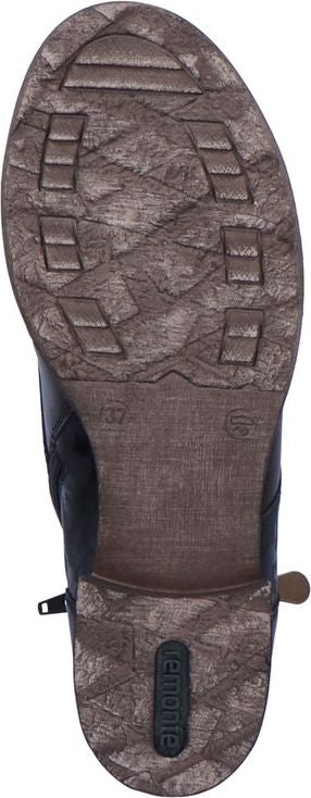 Bottom view of a shoe sole with textured surface and embedded logo 'remonte'.