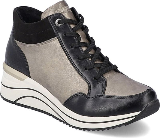 High-top sneaker with black trim, black laces, and a metallic silver body on a white platform sole.