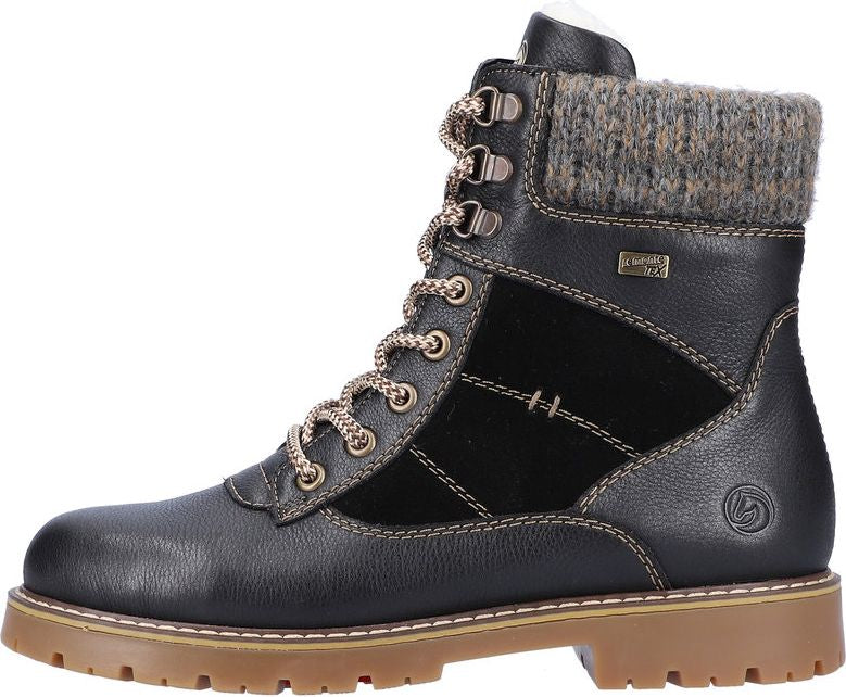 Black lace-up boot with knit top and lug sole.