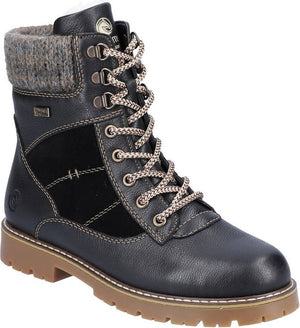 Black lace-up boot with knit trim and thick tan sole.