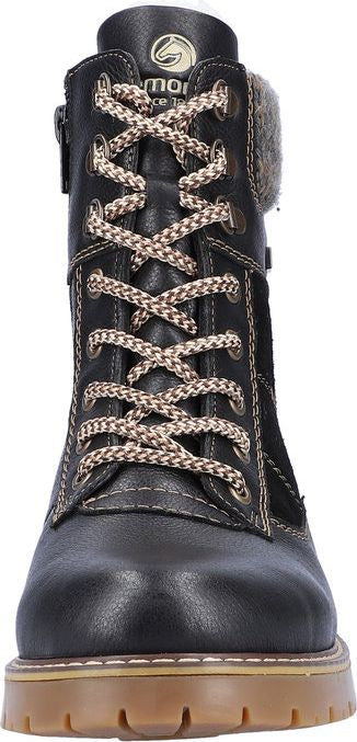 A black lace-up boot with a lug sole.