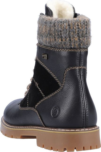 Black boot with knit collar, leather and suede accents, and lug sole.