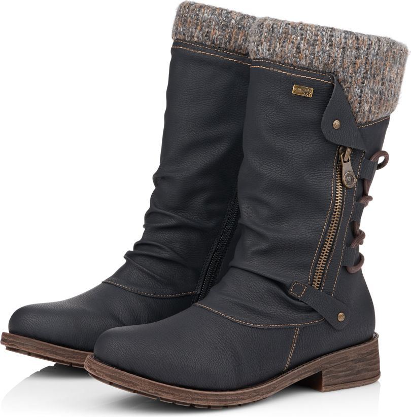 Knee-high black boots with knit cuff, decorative side zipper, and lace-up detail.