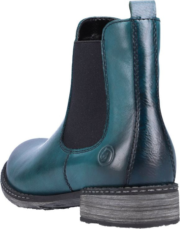 Teal leather Chelsea boot with a black elastic side panel and a low, gray heel.