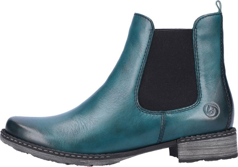 Teal Chelsea boot with a small, flat heel and black elastic sides.