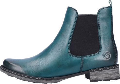Teal Chelsea boot with a small, flat heel and black elastic sides.