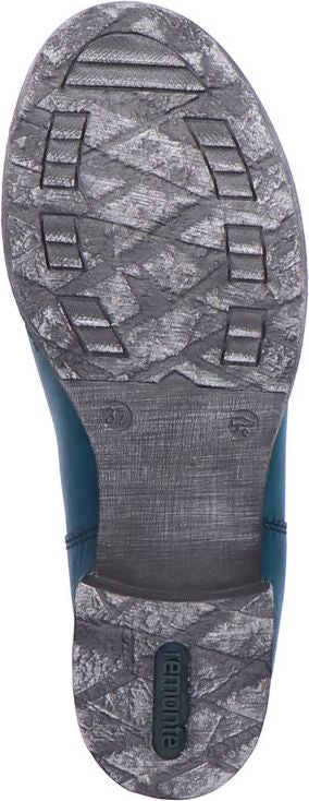 Sole of a boot showing textured rubber pattern and brand name.