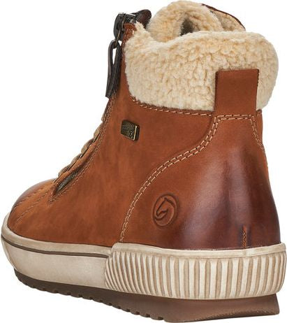Back view of a brown, high-top, lace-up boot with a zipper and beige fur trim around the ankle.