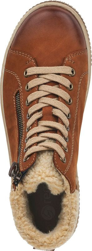 Tan-colored lace-up shoe with faux fur lining.