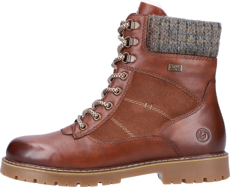 Brown leather lace-up boot with fabric cuff and lug sole.