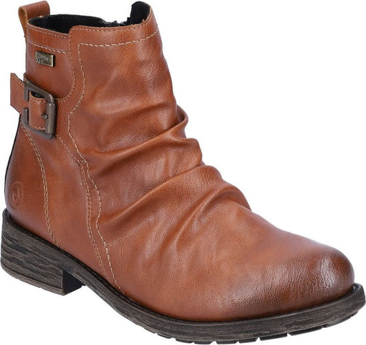 Tan ankle boot with buckle.