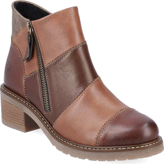Patchwork ankle boot with brown and tan leather and a side zipper.