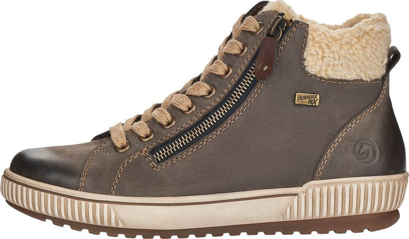 High-top leather boot with tan laces, side zip, and faux fur lining around the ankle.