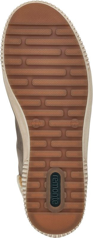 A shoe sole with brown rectangular treads and the brand name 'remonte' visible.