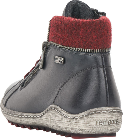 A black leather ankle boot with a red wool collar and a zipper on the side.  The sole is light grey with a red accent.