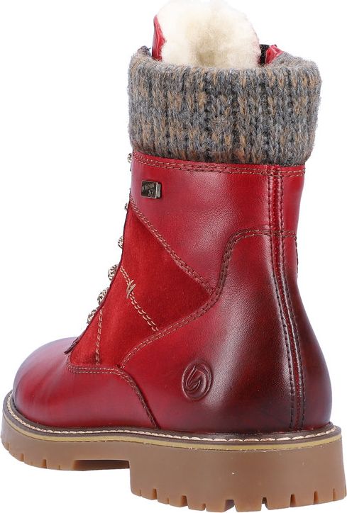 Red leather ankle boot with sweater knit cuff and lug sole.