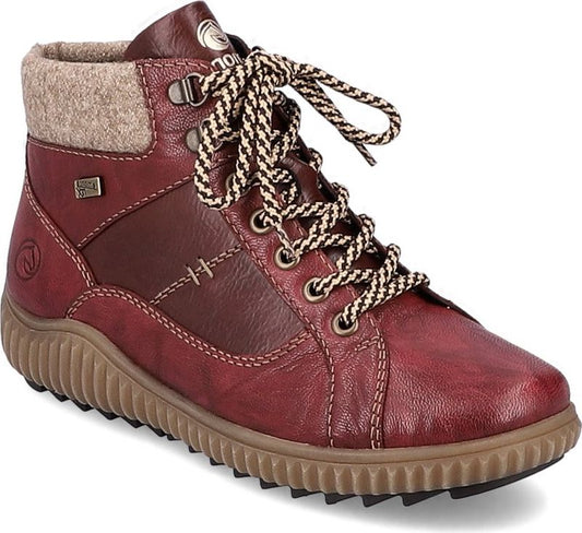 Red ankle boot with tan treaded sole, lace-up closure, and felt-like collar.
