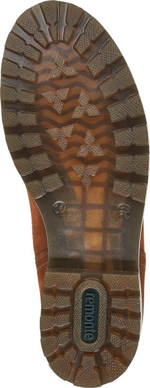 The sole of a shoe with a textured pattern and the word "remonte" visible in an oval shape.