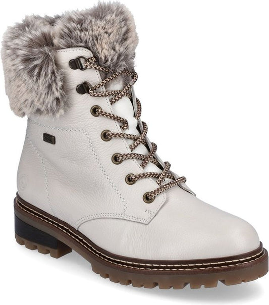 White leather ankle boot with faux fur trim and lace-up closure.