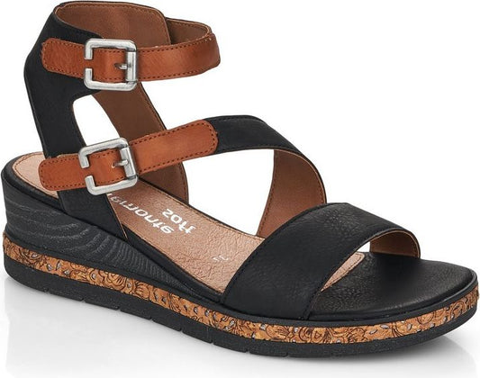 Black and tan wedge sandal with adjustable buckle straps.