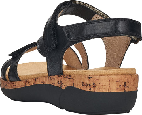 Black platform sandal with cork midsole and adjustable velcro straps.