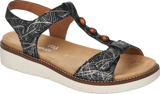 Black sandal with white, swirling print, T-strap with brown beads, tan footbed, white platform sole.