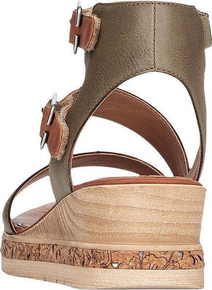 Olive green wedge sandal with brown straps and buckles.