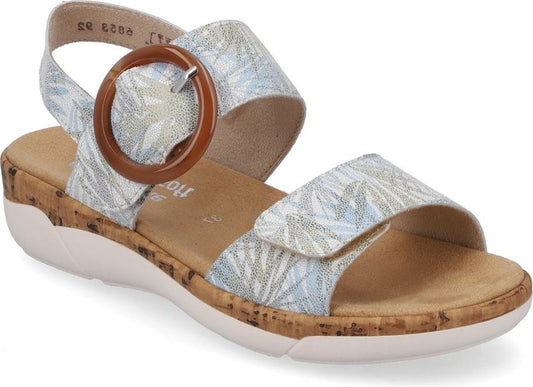 Light blue and white floral print sandal with brown buckle on an ankle strap, cork footbed, and white sole.