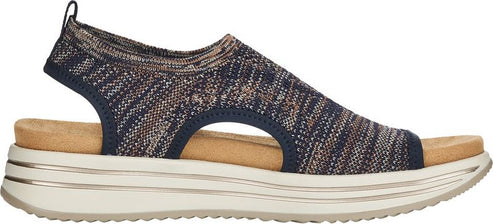 A sandal with a navy, tan, and white woven upper and a beige sole.