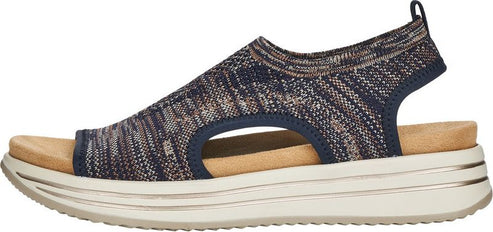 Sandals with a navy and tan knit upper, an open toe, and a thick layered sole.