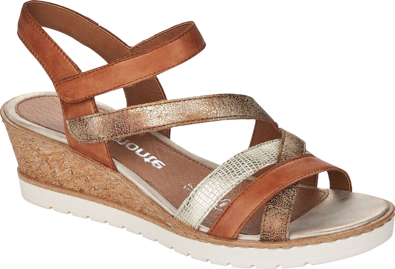Wedge heel sandal with cork midsole, hook and loop ankle strap, and crossed toe straps.