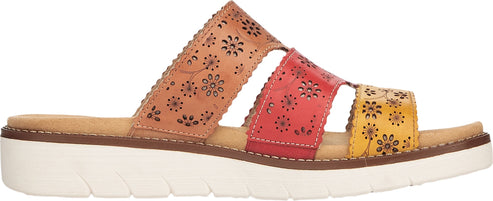A sandal with tan, red, and yellow straps that have a flower pattern.