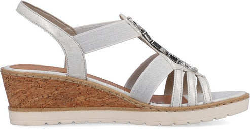 Silver sandal with cork wedge heel and multi-strap design.