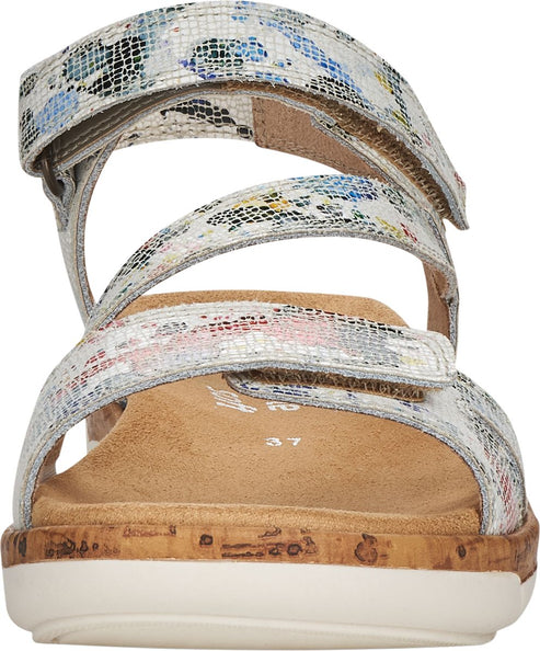 Front view of a sandal with floral patterned straps and a cork-style platform sole.
