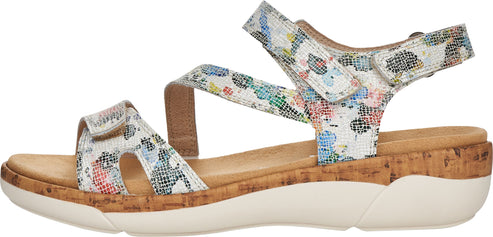 Floral print sandal with adjustable straps and a cork wedge heel.