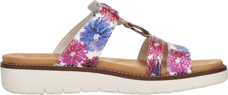 A side-view of a platform sandal with floral straps in white, pink, and blue.