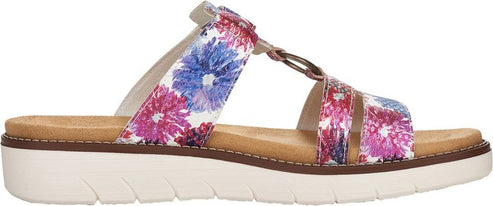 A side-view of a platform sandal with floral straps in white, pink, and blue.