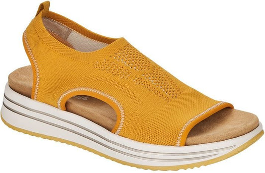 Mustard yellow knit sandal with a white platform sole and peep toe.