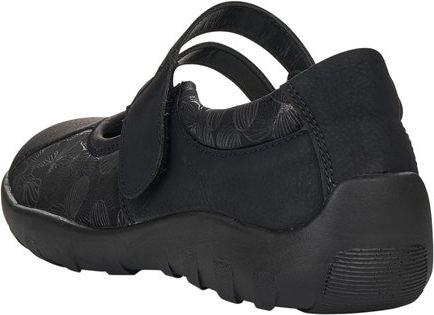 Black Mary Jane style shoe with hook and loop strap closure and low platform sole.