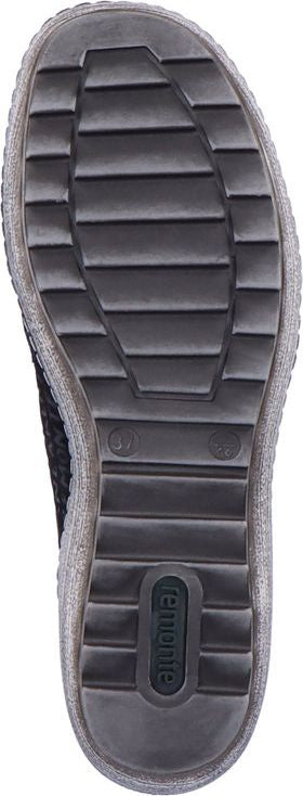 The outsole of a shoe has a grid pattern.