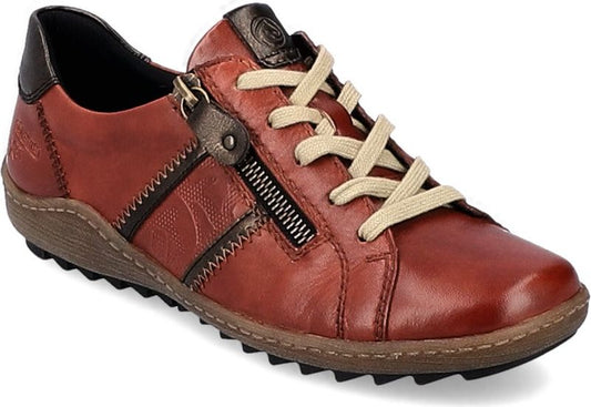 A rust-colored leather sneaker with a side zipper and tan laces.