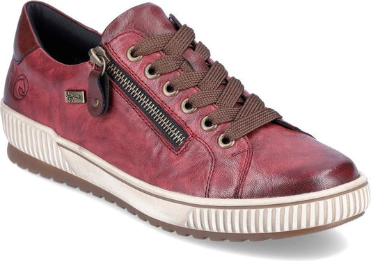 Red leather sneaker with side zipper and brown laces.