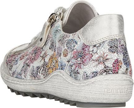 White floral sneaker with silver heel and zipper.