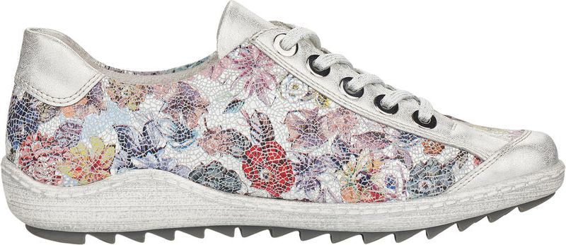 Floral patterned sneaker with metallic accents and white laces.