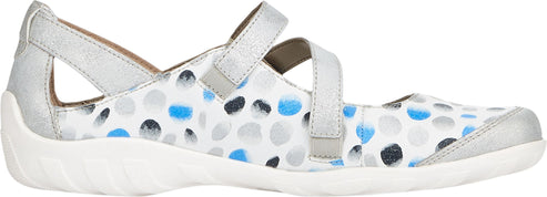 A white Mary Jane shoe with blue and gray dots, silver straps, and a white sole.