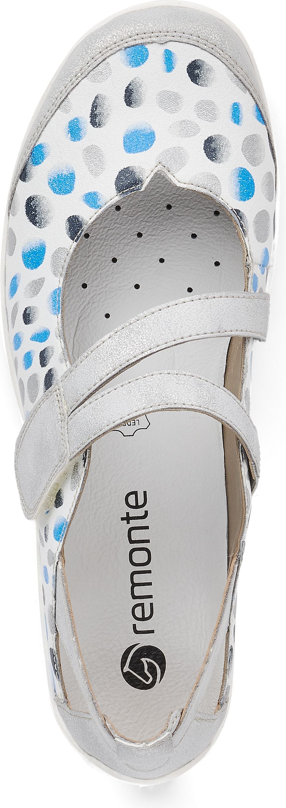 A flat shoe with white, grey, and blue polka dots, and a grey velcro strap.