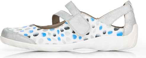 A white flat with a velcro strap and blue and gray circles.