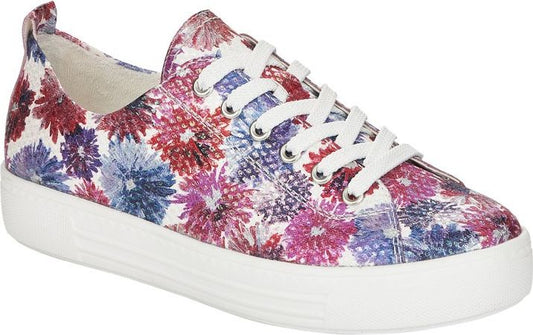 Floral patterned sneaker with white laces and white soles.