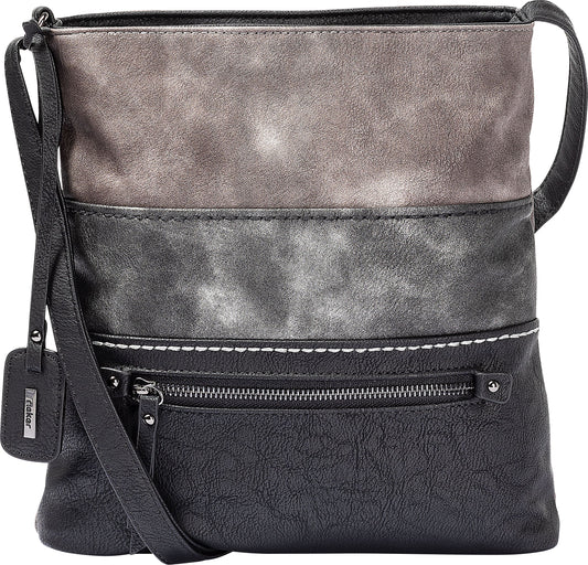 A black and gray vertical striped crossbody bag with a zipper and a leather name tag.