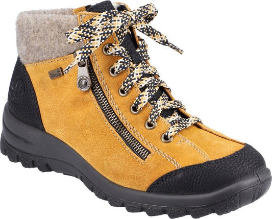 Ankle-high boot in yellow suede with black textured accents, a side zipper, and patterned laces.